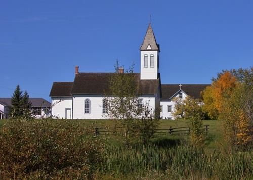 View of the church at Notre Dame des Victoires / Lac La Biche Mission.; Lac La Biche Mission Historical Society | Société historique Lac La Biche Mission, Jennifer Mueller.
