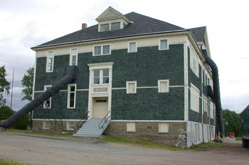 This image illustrates the boys' west side entrance framed by Tuscan pilasters supporting simple cornices. ; PNB 2005