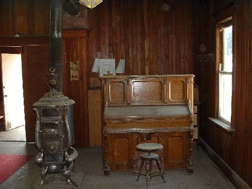 Stove and organ, 2004.; Government of Saskatchewan, Lisa Dale-Burnett, 2004.