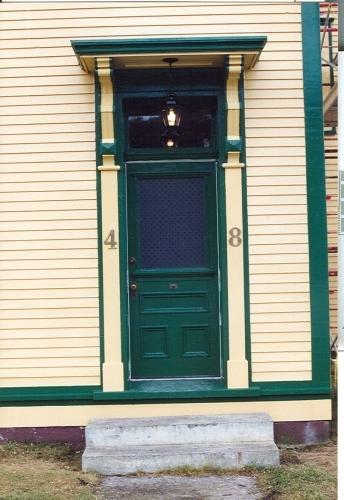 View of main entrance showing decorative shelf, brackets and detailed moulding, O'Reilly House, Placentia.; HFNL/ 2006