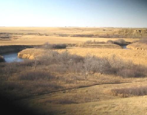 View northwest at reported location of site on near (east) side of Wood River, 2004.; Government of Saskatchewan, Marvin Thomas, 2004.