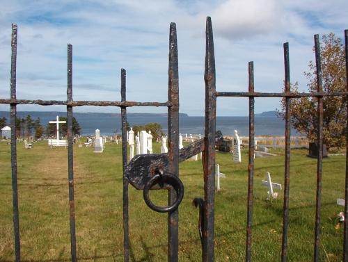 View of the original iron gates to the Topsail United Church Cemtery, accessed from the main road. Photo taken 2006.; HFNL 2009