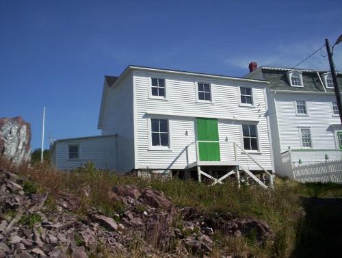 View of front facade of the John Quinton Limited Shop, Red Cliffe, NL, taken September 24, 2006, showing the residence to the right.; HFNL/Dale Jarvis 2006