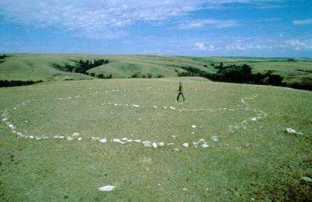 View of kidney-shaped fieldstone ceremonial feature, 1973.; Government of Saskatchewan, 1973.
