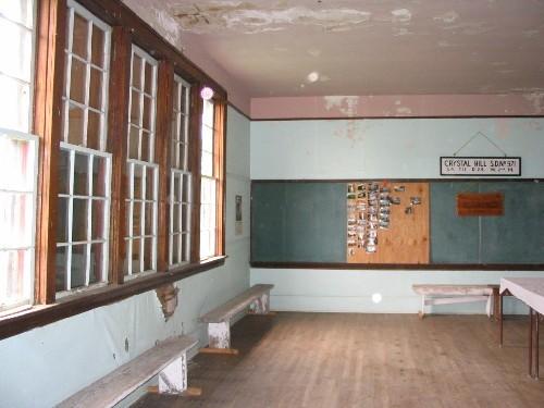 Interior of Crystal Hill School showing large bank of windows on the west side of the school.; Government of Saskatchewan, Lisa Dale-Burnett, 2004.