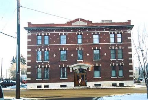 This image illustrates the overall form and massing of the Hecla Block, in its prominent corner location.; City of Edmonton, 2004