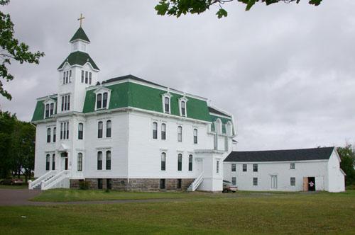This image of the Second Empire Building shows the cut-stone foundation and the main portico opening onto the ground floor.; PNB 2005