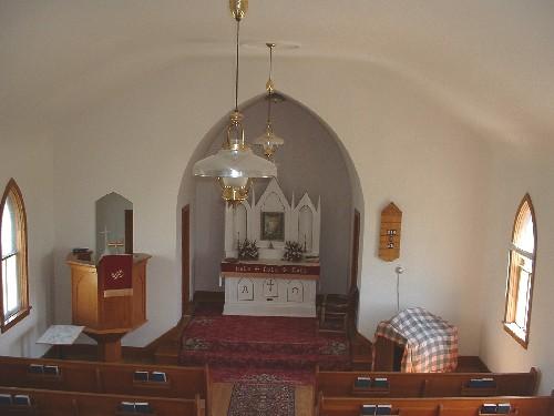 View of altar and raised pulpit from rear loft.; Government of Saskatchewan, Lisa Dale-Burnett, 2004.