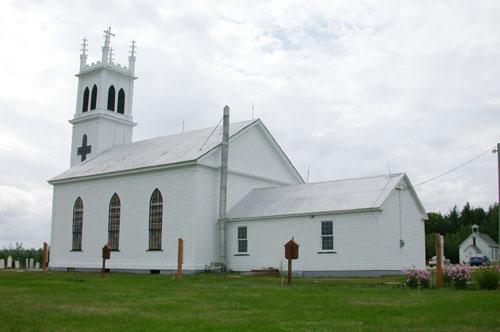 This image depicts the neo-Classical style of the building, with its gable roof on a rectangular plan erected on a dressed sandstone foundation with a sacristy addition on the east end.; PNB 2005