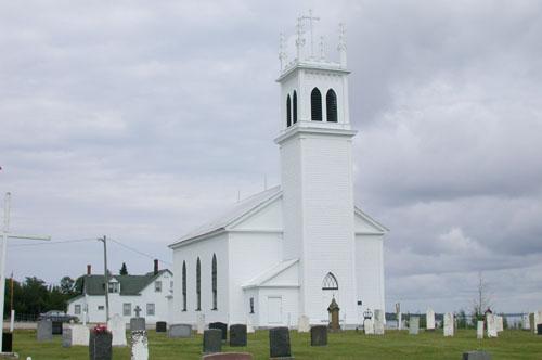 View of the graveyard and the front facade of the church with bell tower exemplifying the transitional interplay between Gothic and Neo-Classical architectural styles.; PNB 2005
