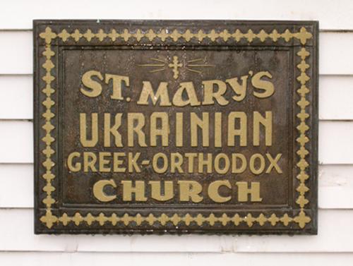 Exterior view of historic plaque, side of church, 2004; City of Surrey 2004