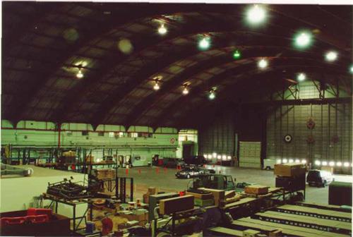 The interior hangar space of Hangar 14, showing the west interior elevation on the right where the aircraft door is situated, and the south interior elevation on the right, 2001.; Agence Parcs Canada / Parks Canada Agency, E. Tumak, 2001.