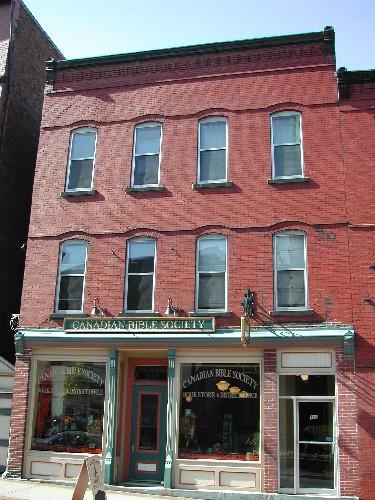 This is a contextual photograph showing the building and its relationship with the building to the north and the alleyway to the south, 2004; City of Saint John
