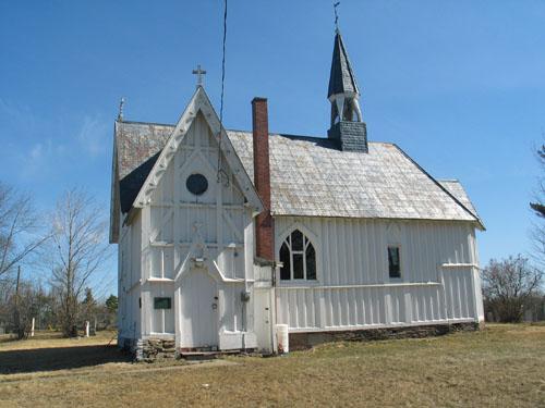 This image presents the dramatic Neo-Gothic stylistic detail of the building evident in the bargeboards and window tracery.; PNB 2005
