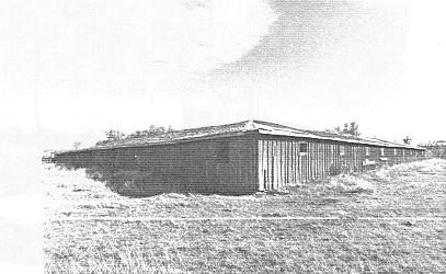 Corner view of the Percheron Box Stalls, showing its extensive scale and unusual massing, 1992.; Public Works Canada, A & E Services - CPS, WRO, 1992 / Ministère des Travaux publics, SAG, PC, BRO, 1992.