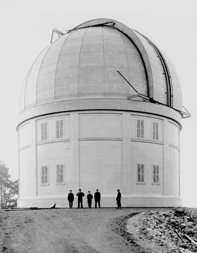 Side view of the Dominion Astrophysical Observatory showing its simple cylindrical massing with dome.; Parks Canada Agency / Agence Parcs Canada, Andrew Waldron.