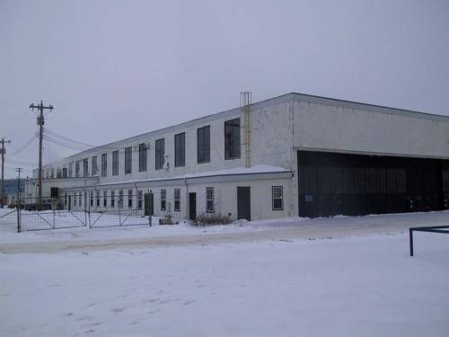 View of Hangar #14 looking toward the southwest corner showing the windows on the west facade and the large doors for movement of aircraft on the south facade (January 2005); City of Edmonton, 2005