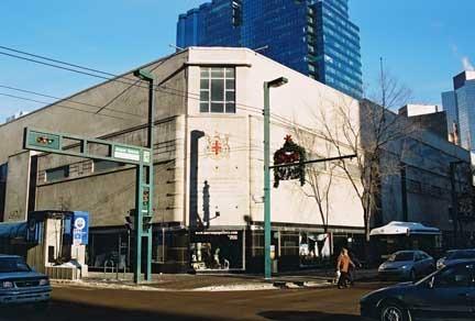 This view of the Hudson's Bay Company Department Store illustrates the prominent block-long Tyndall stone and granite-clad facade facing jasper Avenue, as well as the corner features at 103 Street.; City of Edmonton, 2004