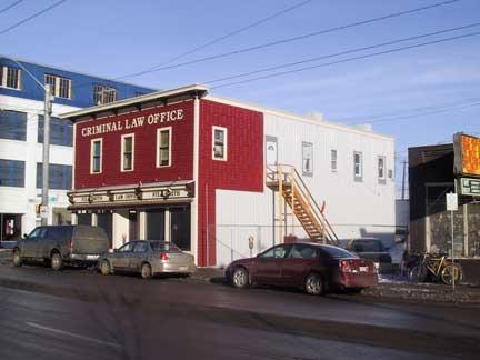 This image illustrates the overall form and massing of the Kingston Powell Building, in its corner location as seen from the southwest (2004).; City of Edmonton, 2004