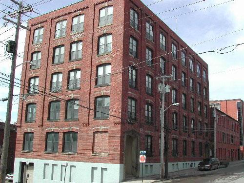 This photograph displays the building’s facades on Canterbury and Duke Street and shows the slope of the hill on Duke Street and the neighboring building on Canterbury Street, 2004.; City of Saint John