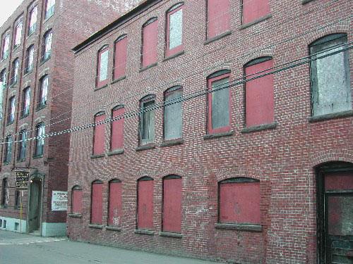 This photograph shows the windows and the proximity of the building to the corner building to the south, 2004.; City of Saint John