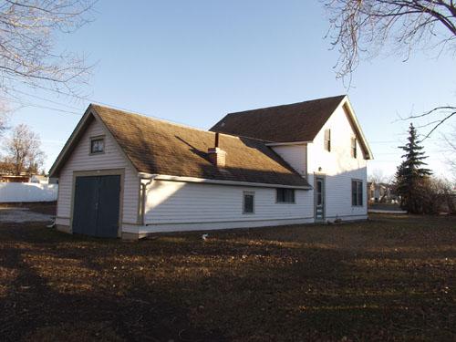 Reverend Forbes Homestead - view of the front door of the house with the original hospital annex on the left (December 2002); Alberta Culture and Community Spirit, Historic Resources Management Branch, 2002