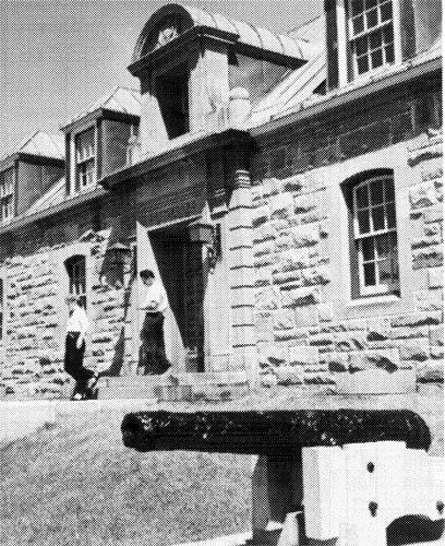 Detail view of the Museum showing the elegant cut stone entry surround of the entrance.; National Film Board of Canada \ Office national du film du Canada, D622089, n.d.