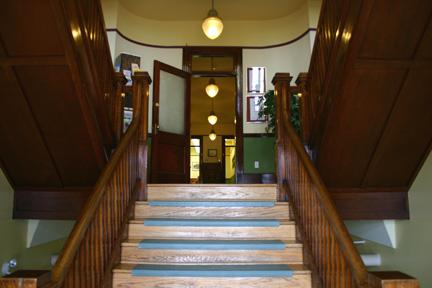 View of double-scissor wooden staircases in entrance of the Memorial Hall, Carman 2005; Historic Resources Branch, Manitoba Culture, Heritage, Tourism and Sport, 2005