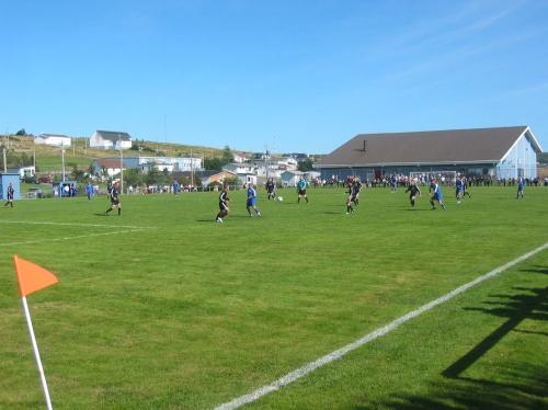 St. Lawrence Centennial Soccer Field, St. Lawrence, NL.  Photo taken during a game, summer 2005. View looking towards the beach.; HFNL/ Jean Loder 2005.
