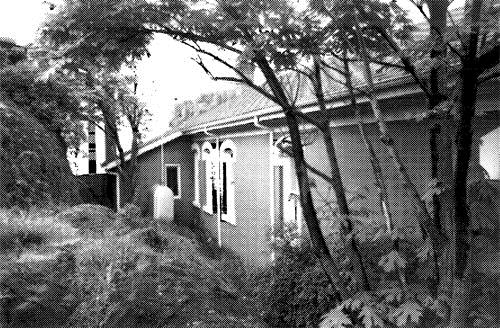 General view of Building 29 showing the rear elevation, 1989.; Agence Parcs Canada / Parks Canada Agency, I. Doull, 1989