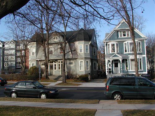 5651 - 5691 Inglis Street, Halifax, Nova Scotia, 2004. Note the projecting bays, decorative trim, side hall plan, bracketed eaves.; HRM Planning and Development Services, Heritage Property Program, 2004.