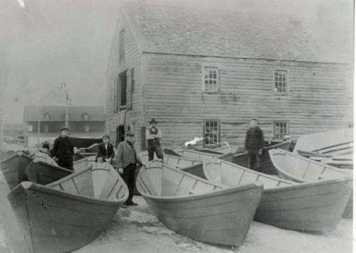 Workers posing with new dories outside of the Dory Shop, Shelburne, NS, ca. 1890.; Courtesy of the Shelburne County Museum.