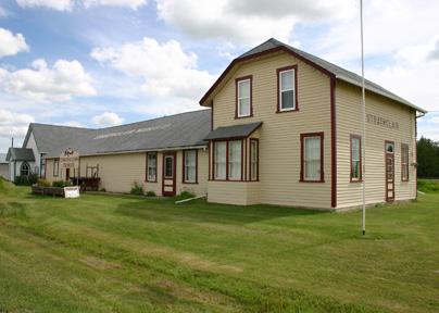 View, from the northwest, of the Strathclair Museum (consisting of the M and NW Railway Station and St. George's Anglican Church), Strathclair, 2005; Historic Resources Branch, Manitoba Culture, Heritage, Tourism and Sport, 2005