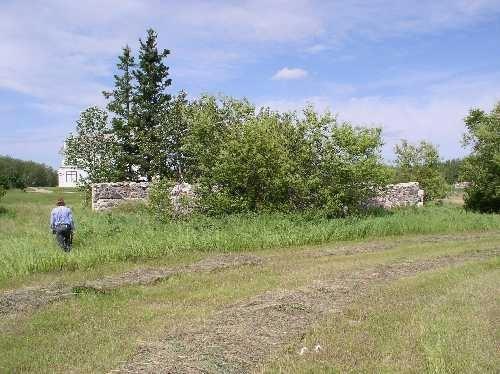 View west at remnant stone walls, 2004.; Government of Saskatchewan, Marvin Thomas, 2004.