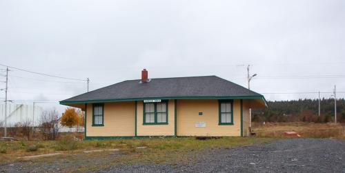 Exterior view of rear facade of the train station showing large, protruding eaves and telegraph bay at center.  Tracks would have been located on the opposite side of this building.; HFNL/ Deborah O'Rielly 2005