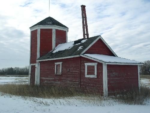 View of pump house portion, showing pulley system extending from the roof, 2003.; Government of Saskatchewan, Jennifer Bisson, 2003.