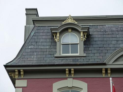 Detail view of Malahat Building, showing its Second Empire style, evident in the mansard roof, 2011.; Parks Canada Agency / Agence Parcs Canada, Andrew Waldron, 2011.