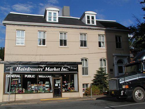 Honourable William Annand House, south half with store front projection, raised basement with windows, Halifax, Nova Scotia, 2005.; Heritage Division, NS Dept. of Tourism, Culture and Heritage, 2005.