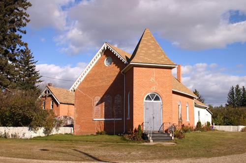 Contextual view, from the southwest, of the Sidney Church and Manse, Sidney, 2005; Historic Resources Branch, Manitoba Culture, Heritage and Tourism 2005