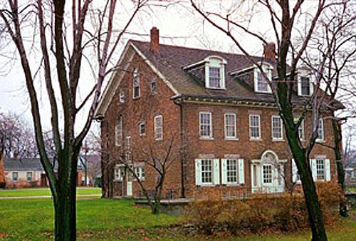 General view of the rear of the Hough House showing the detailed brick masonry accented by stone sills and lintels, 1972.; Parks Canada Agency / Agence Parcs Canada, M. Robinson, 1972.