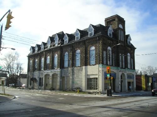 Northeast facade showing fire station doors, rounded arch windows and dormers; D. Menard
City of London