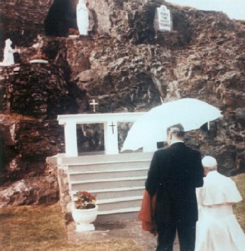 Pope John Paul II kneeling to pray at the front of Our Lady of Lourdes Grotto, Flatrock, 1984/09/12.  ; Courtesy Flatrock Grotto Committee.