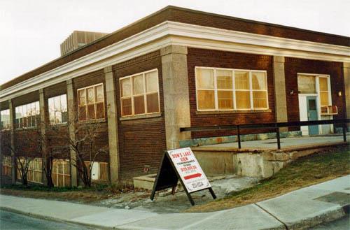 Corner view of the south and east elevations of the Former NCC building showing the large six-over-six wood sash windows, 1997.; Parks Canada Agency / Agence Parcs Canada, R. Goodspeed, 1997.
