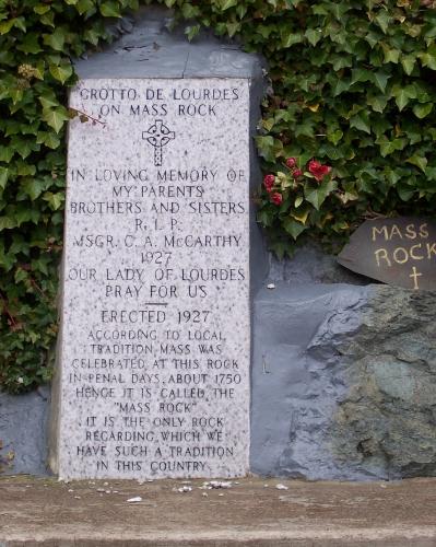 Memorial plaque and section of Mass Rock at the Grotto of Our Lady of Lourdes, Renews, NL. Photo taken December, 2005.; HFNL/Andrea O'Brien 2005