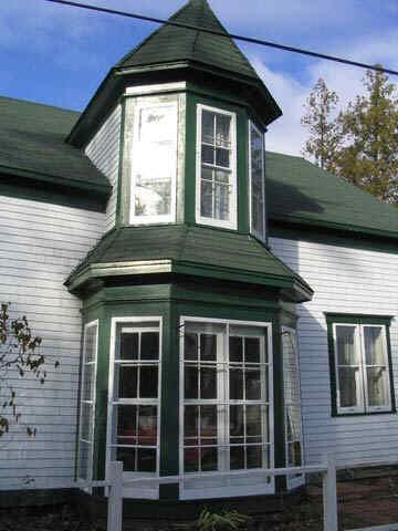 Photo of the "bump" entrance to the de Olloqui House.; Village of Rexton