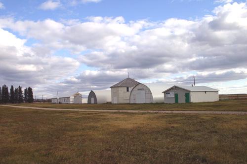 Contextual view, from the northwest, of the Carberry Agricultural Display Building (centre), Carberry, 2006; Historic Resources Branch, Manitoba Culture, Heritage and Tourism 2005