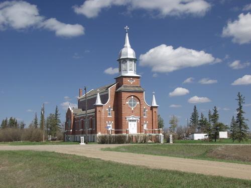 St. Norbert's Roman Catholic Church, as seen from the southwest, dominates the intersection of two rural roads near Provost (April 2003); Alberta Culture and Community Spirit, Historic Resources Management Branch, 2003