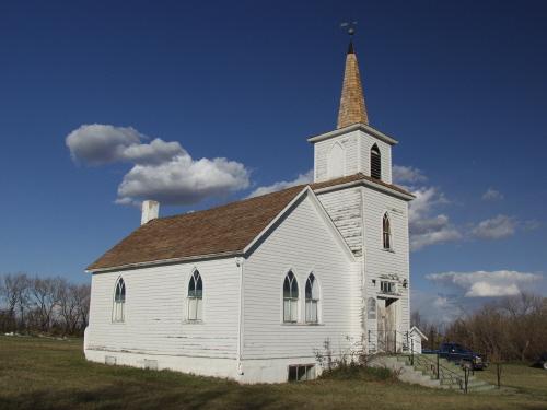 View of the south west facade showing the original 1910 structure with the steeple which was added in 1918 (September 2003); Alberta Culture and Community Spirit, Historic Resources Management Branch, 2003
