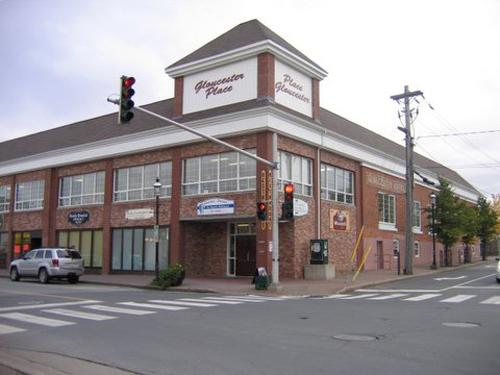 An angled view of the Gloucester building after renovations. It is now called Gloucester Place but still has the original "Gloucester Hotel" inscription on the side of the building.; City of Bathurst