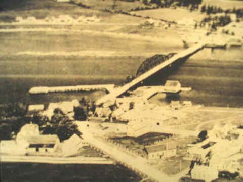 Historic photo showing the Brait estate in the lower left and its location overlooking the Rexton bridge.; Village of Rexton